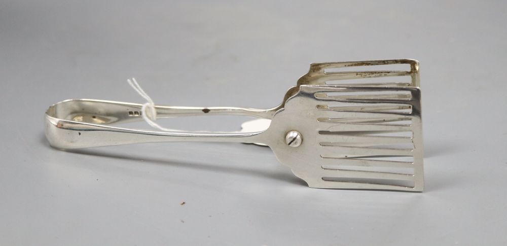 A pair of Old English pattern asparagus tongs, with pierced blades, Asprey & Co, London 1920, 4oz.